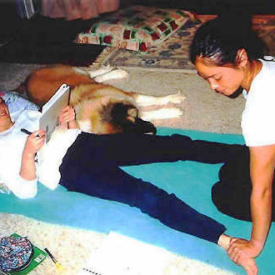 Students practicing Thai massage