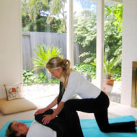 Kimberly giving a Thai massage