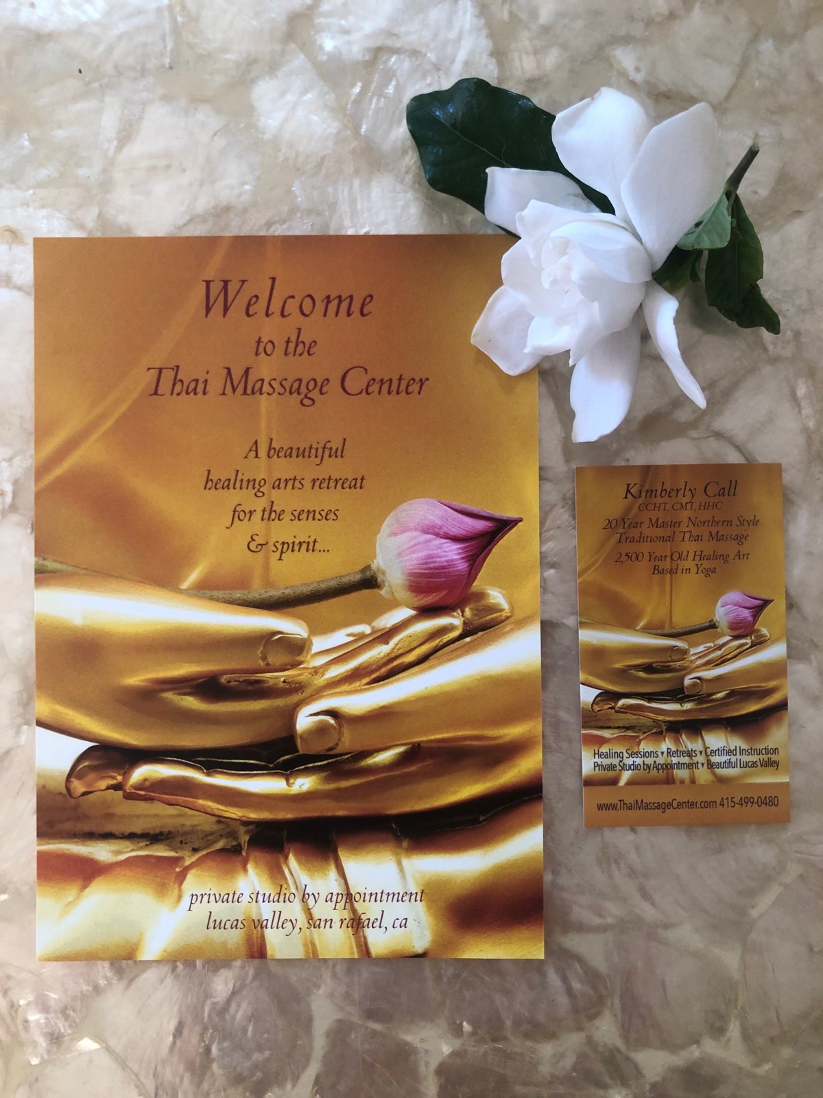 Thai Massage Center gift certificate with a gardenia